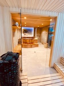 a large room with a glass door on a house at Chalet Pleine Vue & Spa in Chamonix-Mont-Blanc
