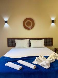 Hotel e Pousada Tetiaroa tesisinde bir odada yatak veya yataklar