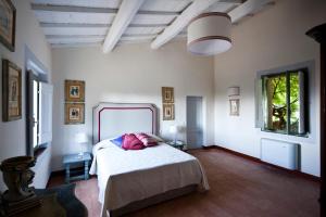 Un pat sau paturi într-o cameră la San Martinello