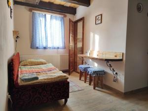 A bed or beds in a room at András penzión