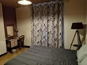 Postel nebo postele na pokoji v ubytování Chambres et table d'hôtes Régord'âne