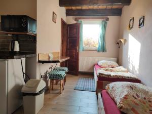 A bed or beds in a room at András penzión