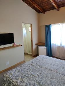 Postel nebo postele na pokoji v ubytování Hostal El Korú
