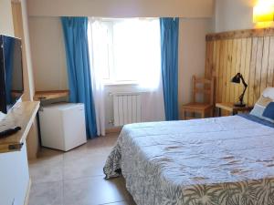 Postel nebo postele na pokoji v ubytování Hostal El Korú