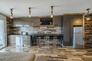 a kitchen with stainless steel appliances and a counter at Captain Americas Apartment in Playa de las Americas