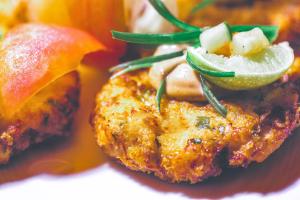 a close up of a piece of food with a lime at Ocean Cliff Hotel Negril Limited in Negril