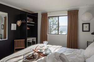 Кровать или кровати в номере Currawong Lakes Tasmania