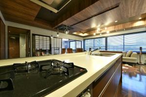 a kitchen with a sink and a stove top oven at Hills Garden Hondori - Vacation STAY 8404 in Sapporo