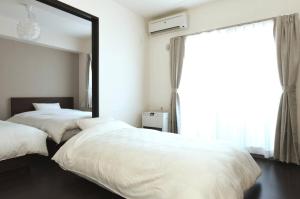 Suncourt Maruyama Goden Hills / Vacation STAY 7602房間的床