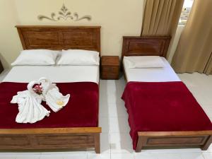 Postel nebo postele na pokoji v ubytování Samudera Hotel