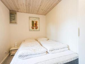 a bedroom with two white beds in it at 6 person holiday home in Nørre Nebel in Nørre Nebel