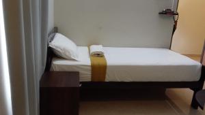 Postel nebo postele na pokoji v ubytování Hotel Akshith Inn