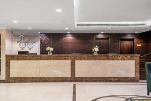 a lobby of a hotel with a reception desk at Taiba Front Hotel in Al Madinah