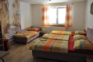A bed or beds in a room at András penzión