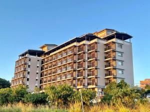 a tall building with balconies on top of it at Golden W Hotel in Shalu