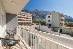 a balcony with a view of a street and buildings at Luxury XXL Apartment in Makarska