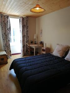 Postel nebo postele na pokoji v ubytování Chambres et table d'hôtes Régord'âne