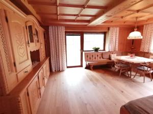 a living room with a table and a dining room at Apartmenthaus PARADISE in Innsbruck