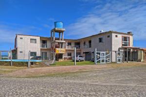 a building with a water tower in front of it at Pousada Colibris in Pinhal