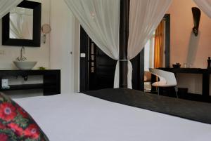 Katil atau katil-katil dalam bilik di Aram Yamí Boutique Hotel