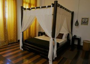 Katil atau katil-katil dalam bilik di Aram Yamí Boutique Hotel