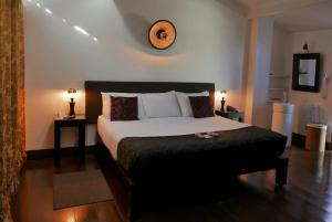 Katil atau katil-katil dalam bilik di Aram Yamí Boutique Hotel