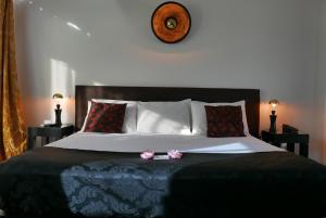 Katil atau katil-katil dalam bilik di Aram Yamí Boutique Hotel
