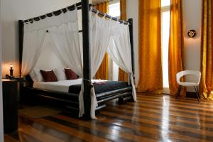 Katil atau katil-katil dalam bilik di Aram Yamí Boutique Hotel