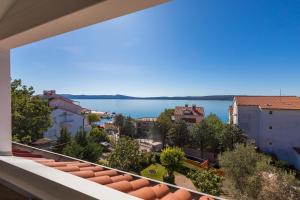 a view of the water from the balcony of a building at Ivan & Anka apartments BOJKO in Selce +81 photos
