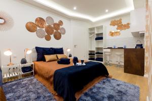 a bedroom with a bed and a blue rug at Budapest Holidays Fashion in Budapest