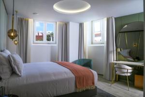 Uma cama ou camas num quarto em São Vicente Alfama Hotel by TRIUS Hotels