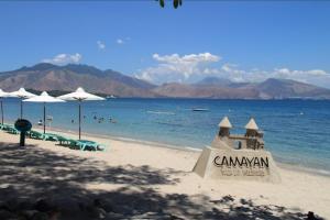 a sand castle on a beach with the ocean at Laly's B8 cozy Vacation Townhouse in Olongapo