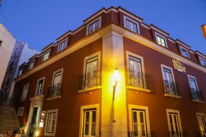 a building with a light on the side of it at Vincci Alfama in Lisbon +33 photos