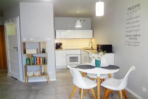 Kuchyňa alebo kuchynka v ubytovaní Holiday Hill Apartamenty Neli