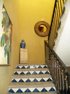 a staircase with blue and white tiled stairs in a house at Hotel Ana Catalina and Suites in San Miguel de Allende