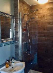 a bathroom with a shower and a sink at The White House Hotel in Newquay