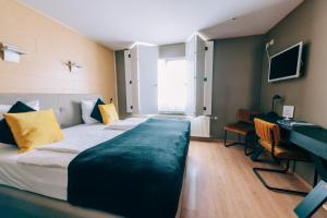 Postel nebo postele na pokoji v ubytování Hotel De Kalvaar