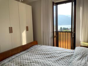 Posteľ alebo postele v izbe v ubytovaní La Casa Sul Sasso In town serviced accommodations