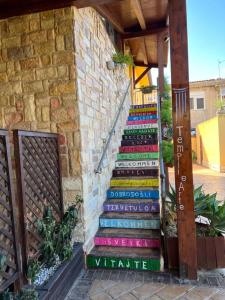 a set of stairs painted in different colors at B&B Templi e Arte in Villaggio Mosè