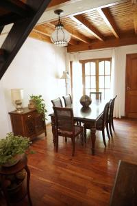 a dining room with a table and chairs at The Blue Room in Mendoza
