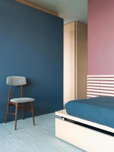Postel nebo postele na pokoji v ubytování LARIUM BED & BREAKFAST - PIGRA
