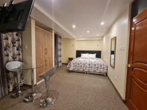 Ένα ή περισσότερα κρεβάτια σε δωμάτιο στο Hostal Tuki Huancayo