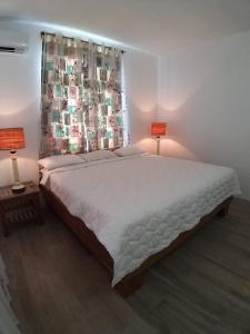 Postel nebo postele na pokoji v ubytování Villa Trochetia
