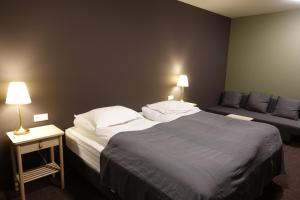 Letto o letti in una camera di Basalt Hotel