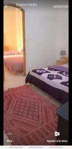 Katil atau katil-katil dalam bilik di Residence Tozeur Almadina