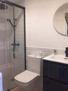 a bathroom with a shower and a toilet and a sink at BRAND NEW & BEST LOCATION!!! SPOTLESS APARTMENT in Sant Feliu de Guixols