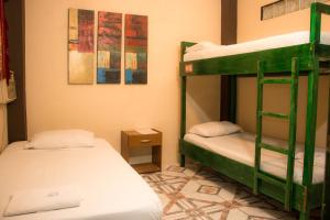Letto o letti in una camera di Dreamkapture Hostel close to the airport and bus terminal