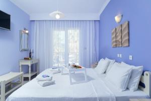 Postel nebo postele na pokoji v ubytování Eleani Hotel
