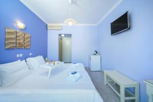 Postel nebo postele na pokoji v ubytování Eleani Hotel