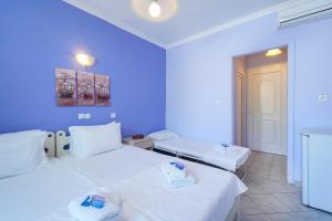 Postel nebo postele na pokoji v ubytování Eleani Hotel